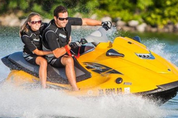 two people riding on a jetski