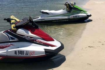 two jetskis on the beach