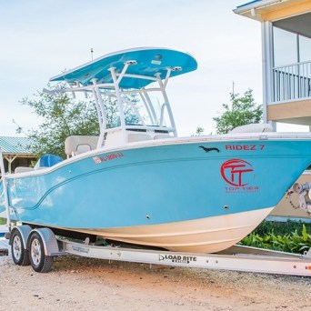 a blue and white center console boat