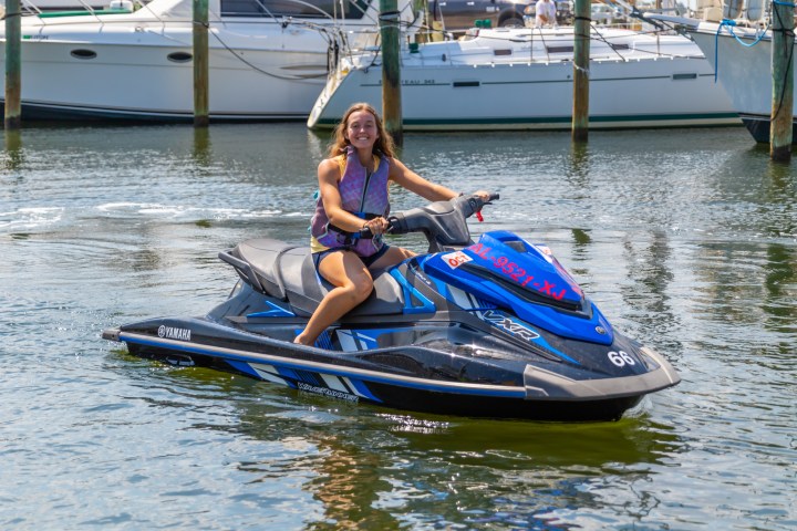 a person sitting on a jetski in the water
