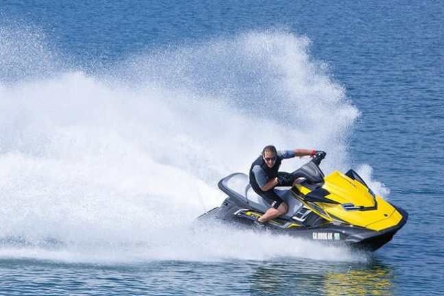 a man riding a jetski in a body of water