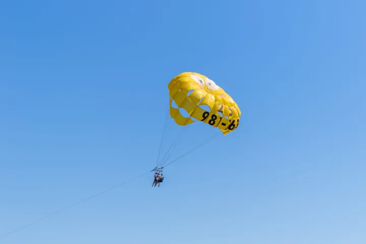 a group of people parasailing
